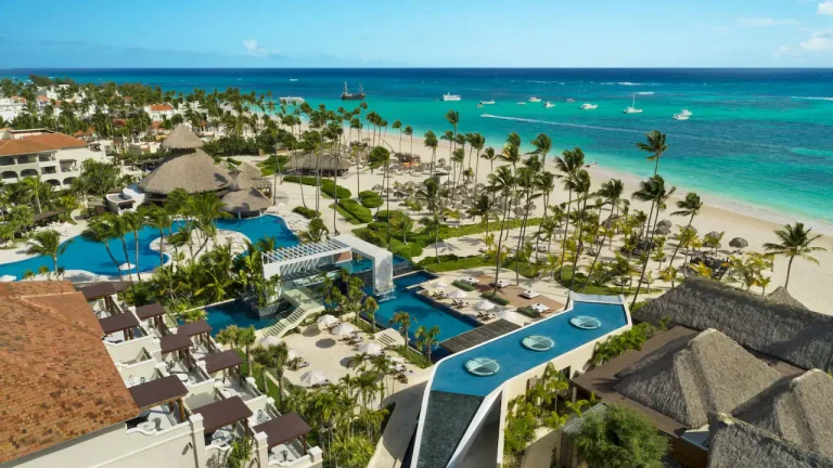 Area view of Secrets Royal Beach Punta Cana Resort Map, showcasing its luxurious beachfront, pools, tropical landscaping, and oceanfront amenities. The image highlights the resort's prime location along the turquoise waters of the Caribbean Sea.